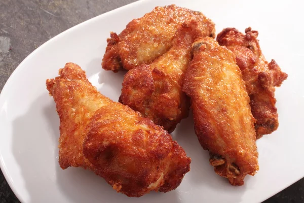 Fried spicy chicken wings — Stock Photo, Image