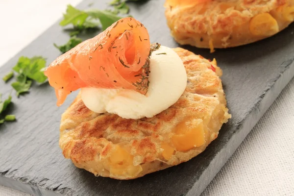 Smoked salmon with corn canapes — Stock Photo, Image