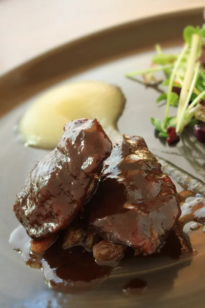 Braised pigs cheeks — Stock Photo, Image