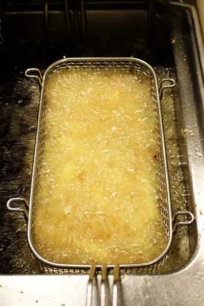 Fryting potato chips — Stock Photo, Image