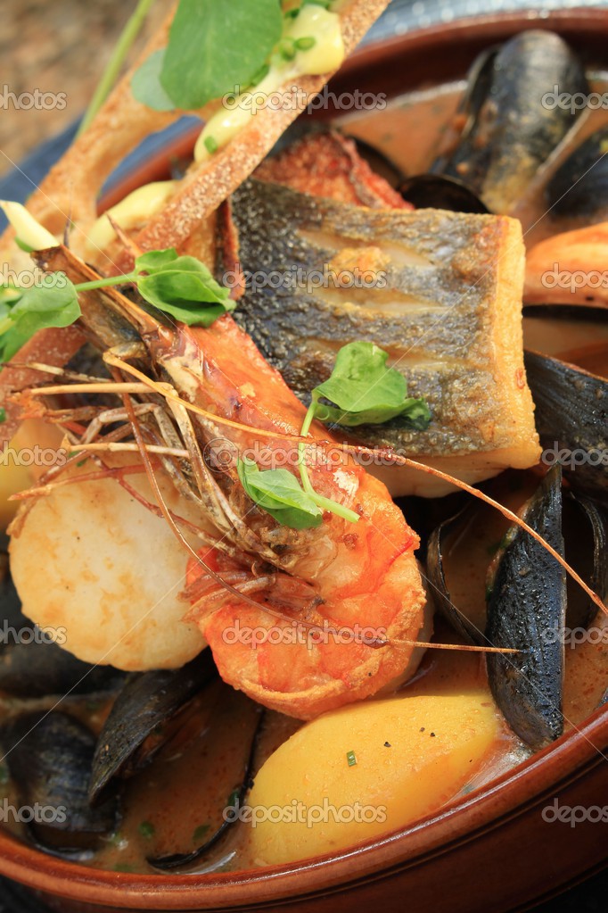 Traditional bouillabaisse fish stew Stock Photo by ©neillangan 49658733