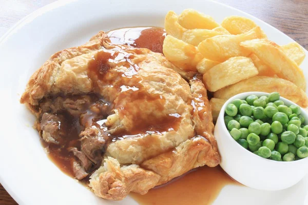 Steak pie with fries and peas plated meal — Stock Photo, Image