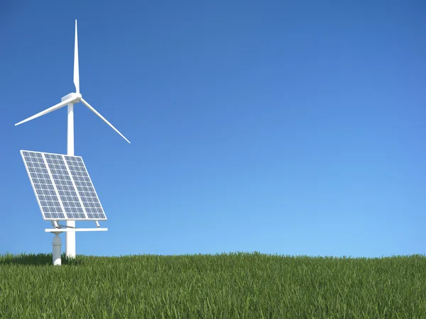 Зеленая трава с солнечной панелью и ветрогенератором — стоковое фото
