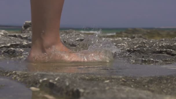 Stepping into the sea water — Stock Video