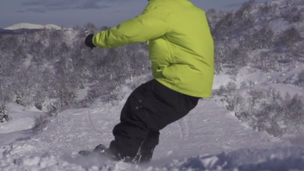 Snowboarder jumping powder kicker — Stock Video