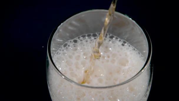 SLOW MOTION, CLOSE UP: Refreshing golden pale ale gets poured into a tall glass. — Video Stock