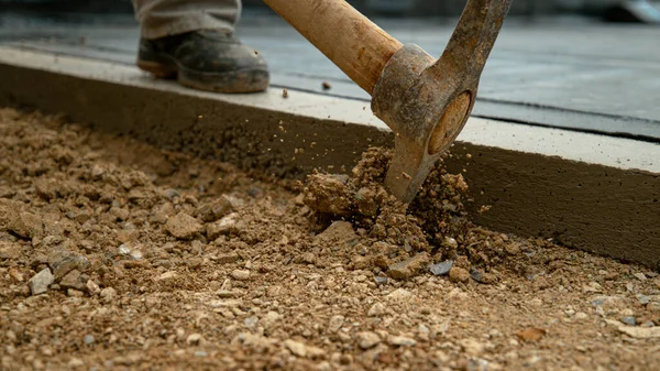 Close Dof Unrecognizable Worker Uses Pickaxe Start Digging Soft Gravel — Fotografia de Stock