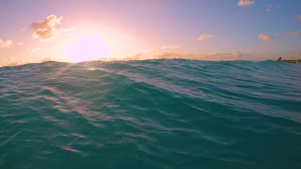 Slow Motion Lens Flare Underwater Deep Blue Breaking Wave Splashes — Stock Video