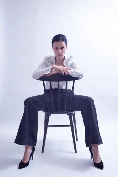 Woman White Shirt Black Trousers Sits Chair — Stock Photo, Image