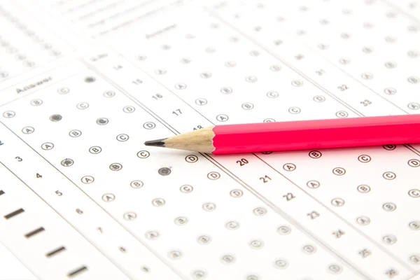 Pink pencil and the answers — Stock Photo, Image