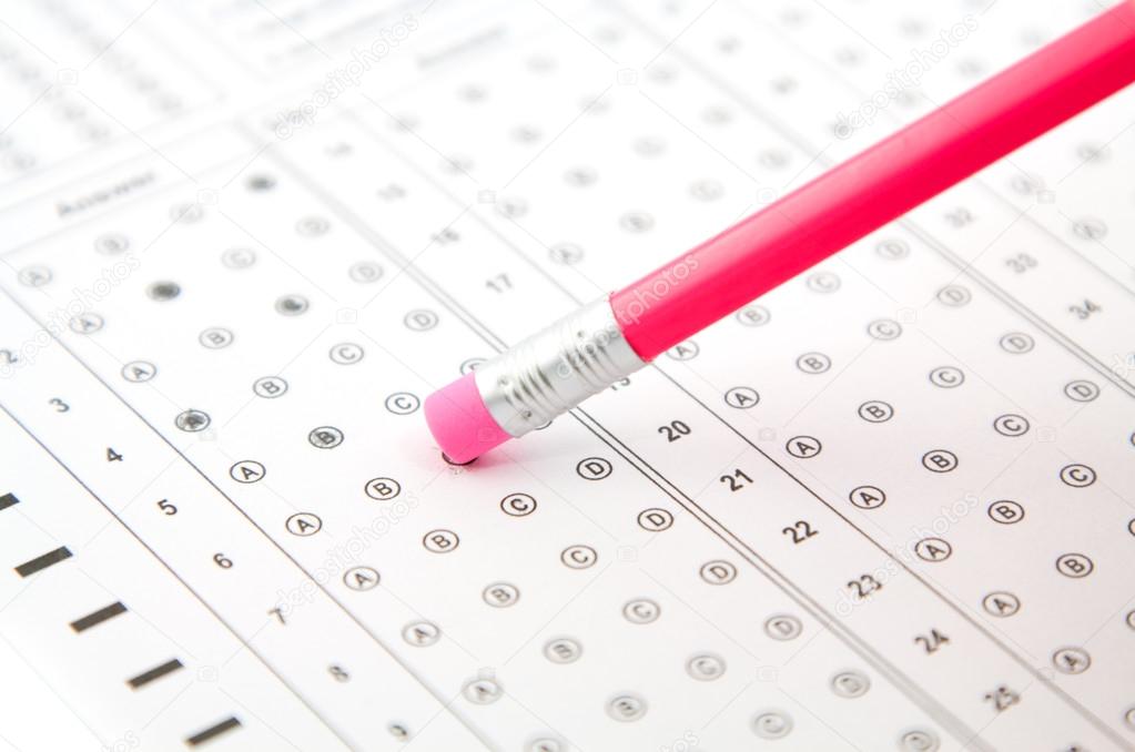 pink eraser on a pencil, and the answers to the test