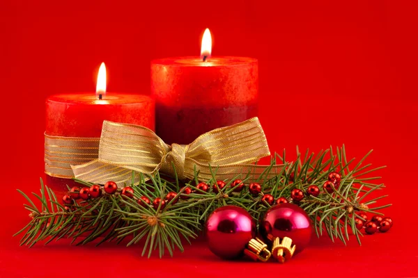 Red candle with xmas tree Royalty Free Stock Photos