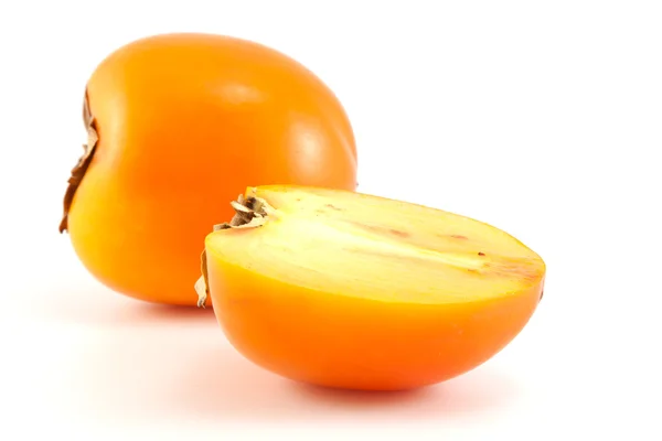 Orange persimmon with slices — Stock Photo, Image