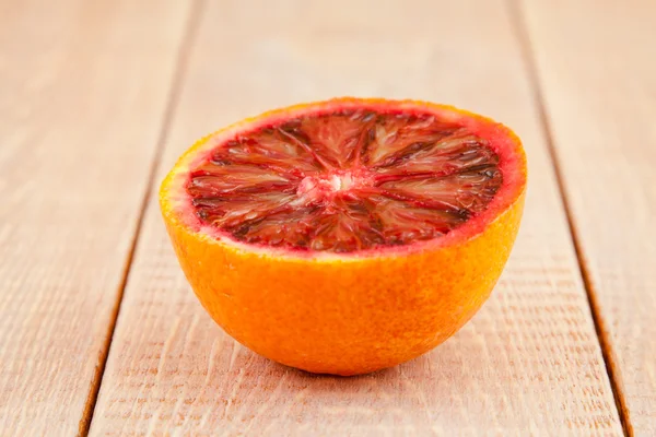 Half of ripe red blood orange — Stock Photo, Image