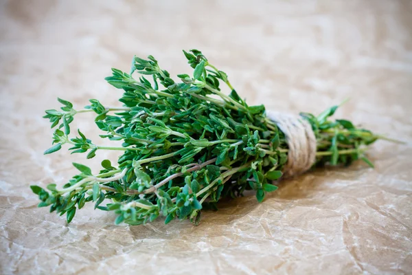 Bunch of fresh thyme on a paper background — Stock Photo, Image