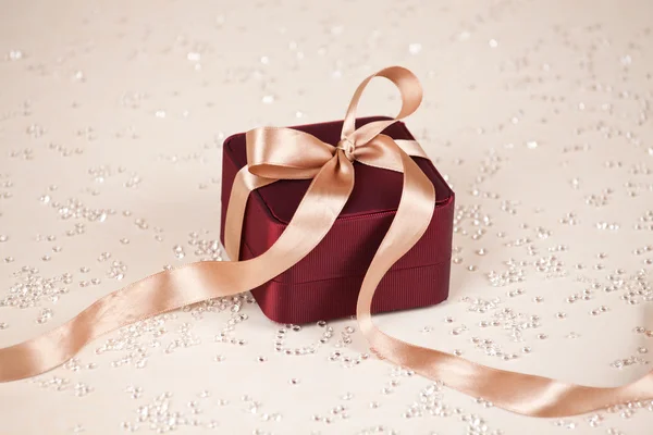 Luxury present on festive lighted background — Stock Photo, Image