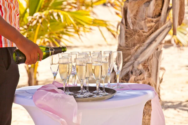 Champagne pouring into glasses — Stock Photo, Image