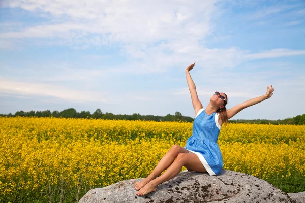 Happy young lady and spring nature in harmony — Stockfoto