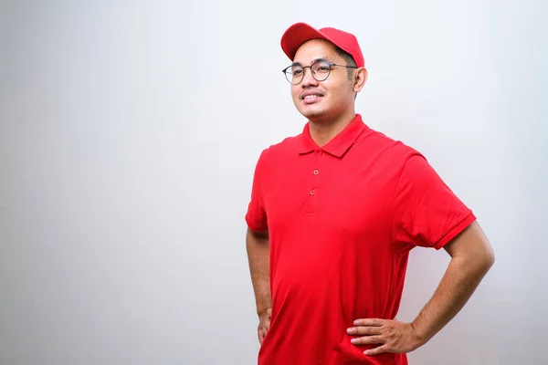 Close Confident Smiling Asian Male Courier Red Uniform Cap Smiling — Zdjęcie stockowe