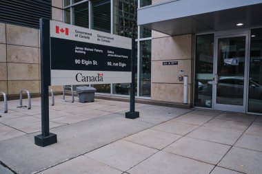 Ottawa, Ontario, Canada - November 14, 2021: A Government of Canada sign outside the James Michael Flaherty Building at 90 Elgin Street, which houses the Department of Finance.