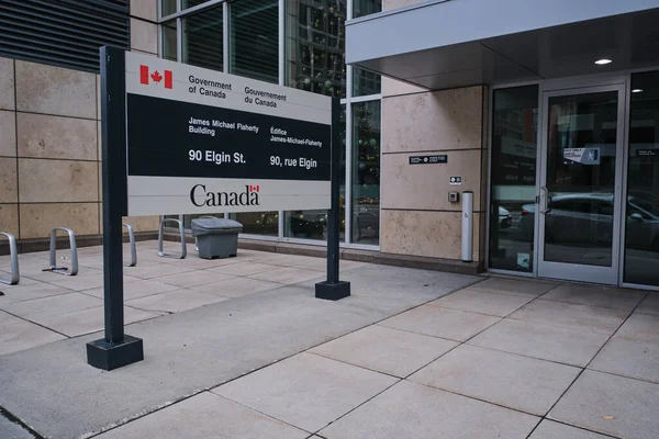 Ottawa, Ontario, Canada - November 14, 2021: A Government of Canada sign outside the James Michael Flaherty Building at 90 Elgin Street, which houses the Department of Finance.