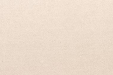 Açık kahverengi bir karton yaprak. Kağıt deseni ince iplik ve noktalarla kaplı..