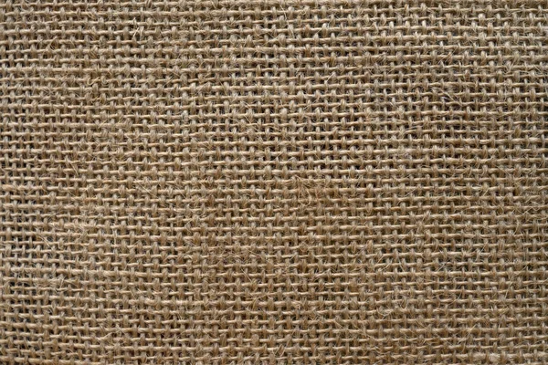 Kahverengi çuval kumaş arka plan, dikey — Stok fotoğraf