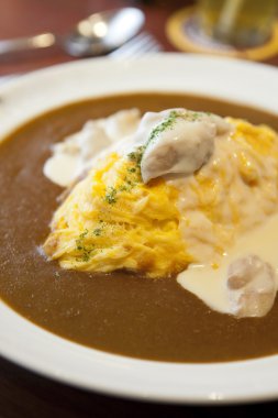 Japanese curry omelette rice with chicken clipart