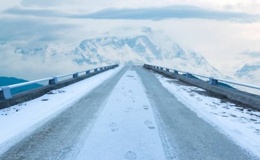 Snow and Road track to Himalayas mountain