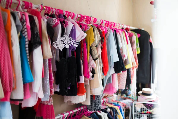 Multi-coloured wardrobe in woman room