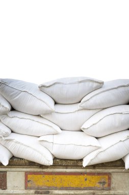 Rice sacks on the truck isolated on white