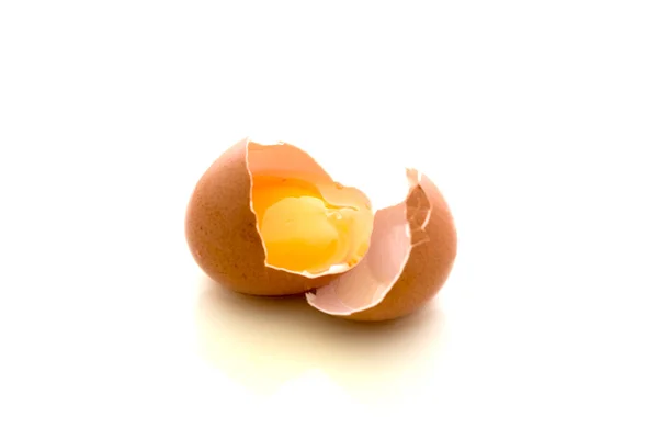 Broken egg on white dish — Stock Photo, Image