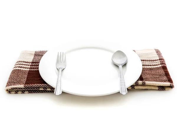 Comedor lugar ajuste. Un plato blanco con tenedor de plata y cuchara — Foto de Stock