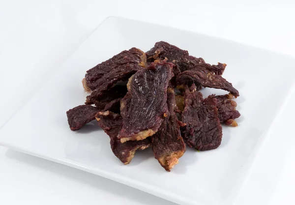 Frying meat on white background — Stock Photo, Image