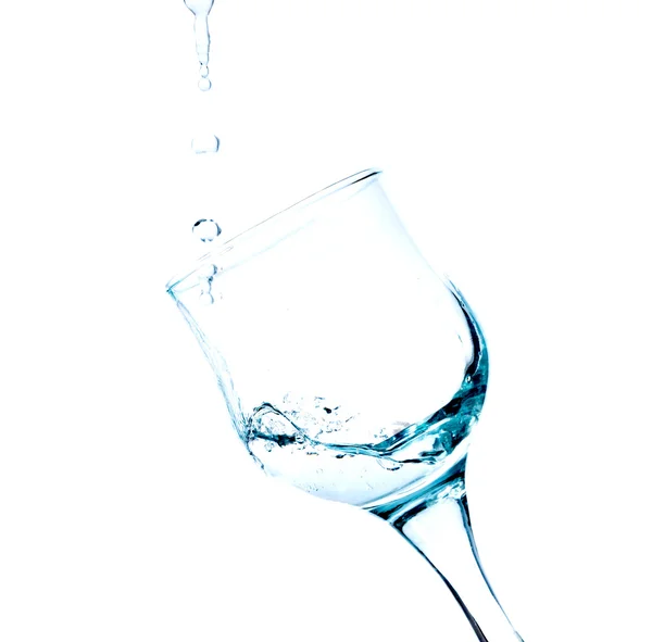 Spetteren in een glas water — Stockfoto