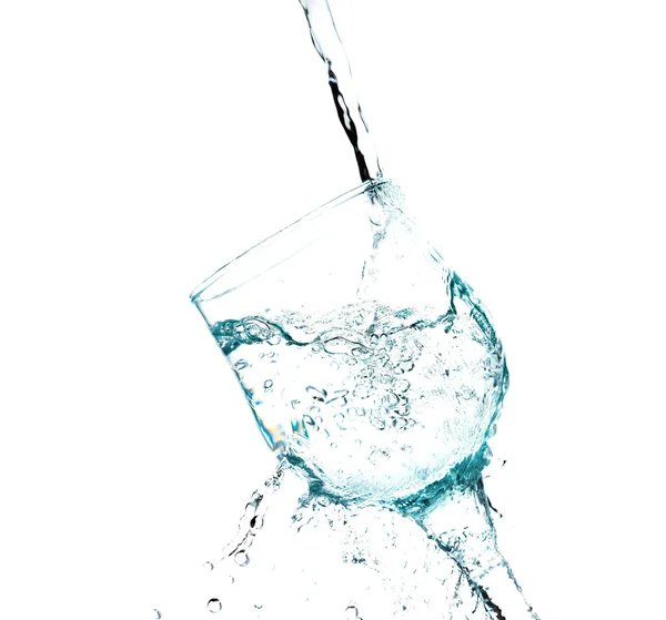 Spetteren in een glas water — Stockfoto