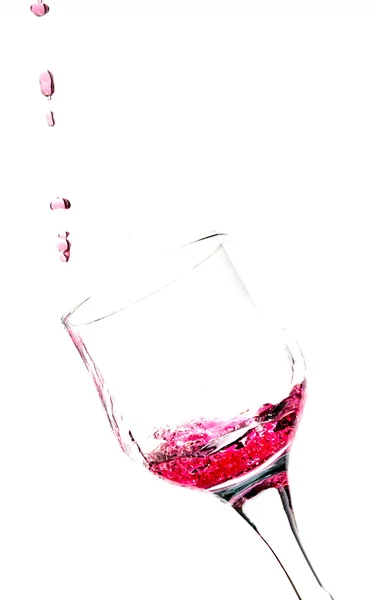 Брызги в бокале красного вина — стоковое фото