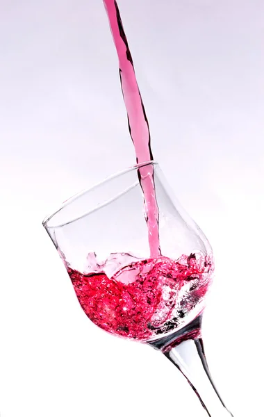 Spritzer in einem Rotweinglas — Stockfoto