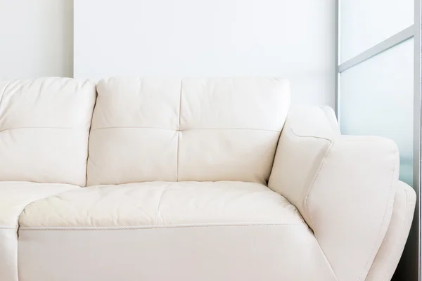 White sofa near glass partition — Stock Photo, Image