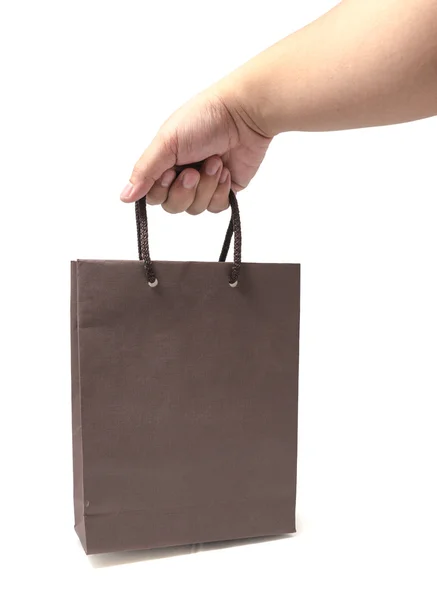 हाथ पकड़ते हुए ब्राउन शॉपिंग बैग — स्टॉक फ़ोटो, इमेज