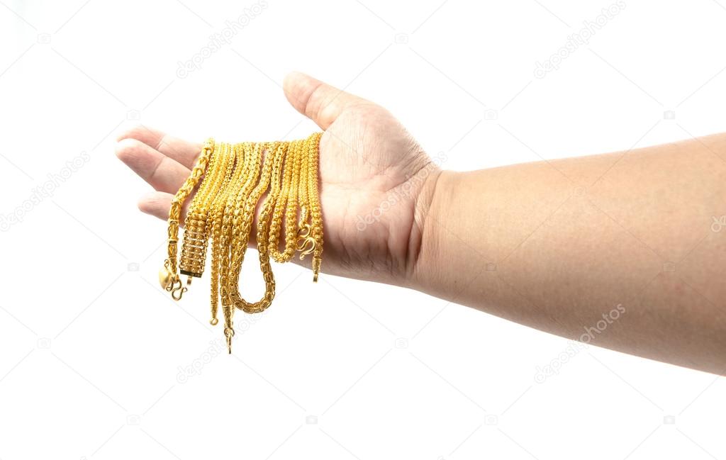 Hand Holding Expensive Gold Jewelry