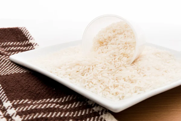 Rice grain (jasmine rice) on table — Stock Photo, Image
