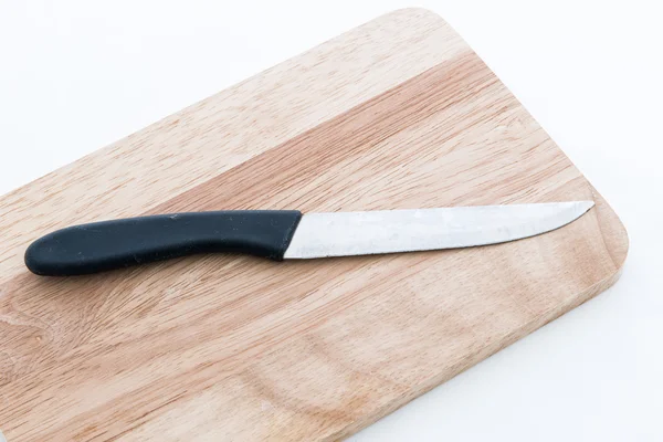 Couteau sur planche à découper en bois — Photo
