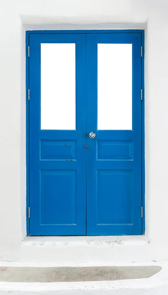 Синяя дверь на белой стене — стоковое фото
