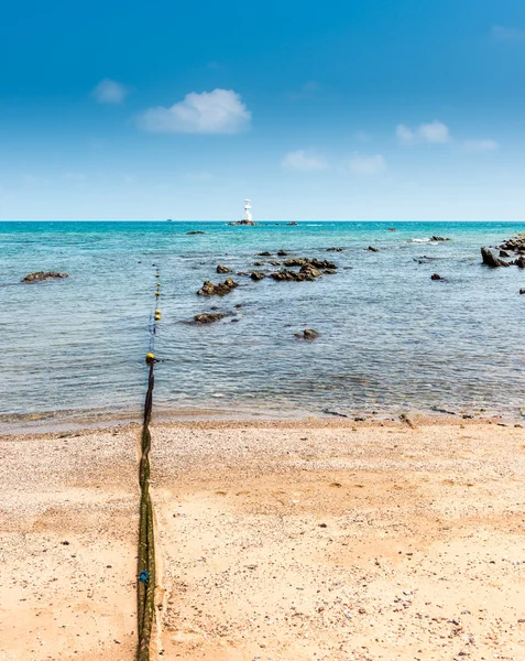 Boyas y faro en la piedra y el mar —  Fotos de Stock