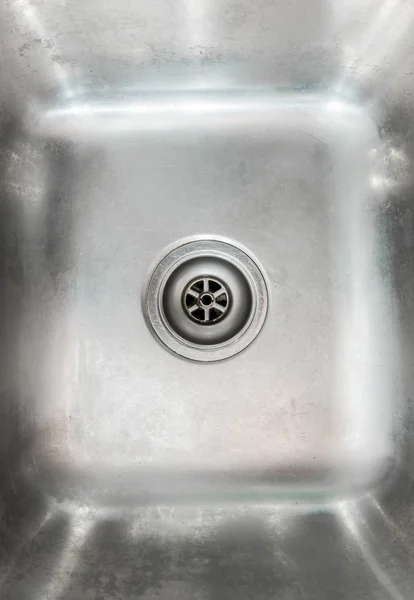 Stainless steel sink plug hole close up — ストック写真