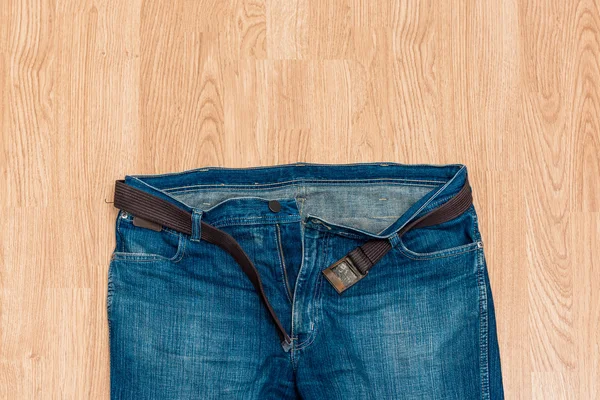 Detail of nice blue jeans with belt — Stock Photo, Image