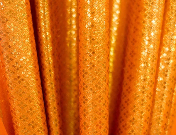 Closeup gouden doek textuur achtergrond — Stockfoto