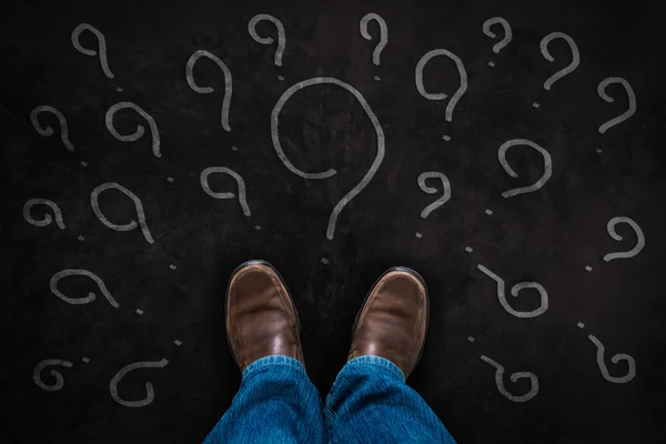 Question concept with Brown leather shoes — Stock Photo, Image