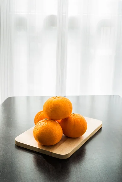 Oranges set on wooden base — Stock Photo, Image